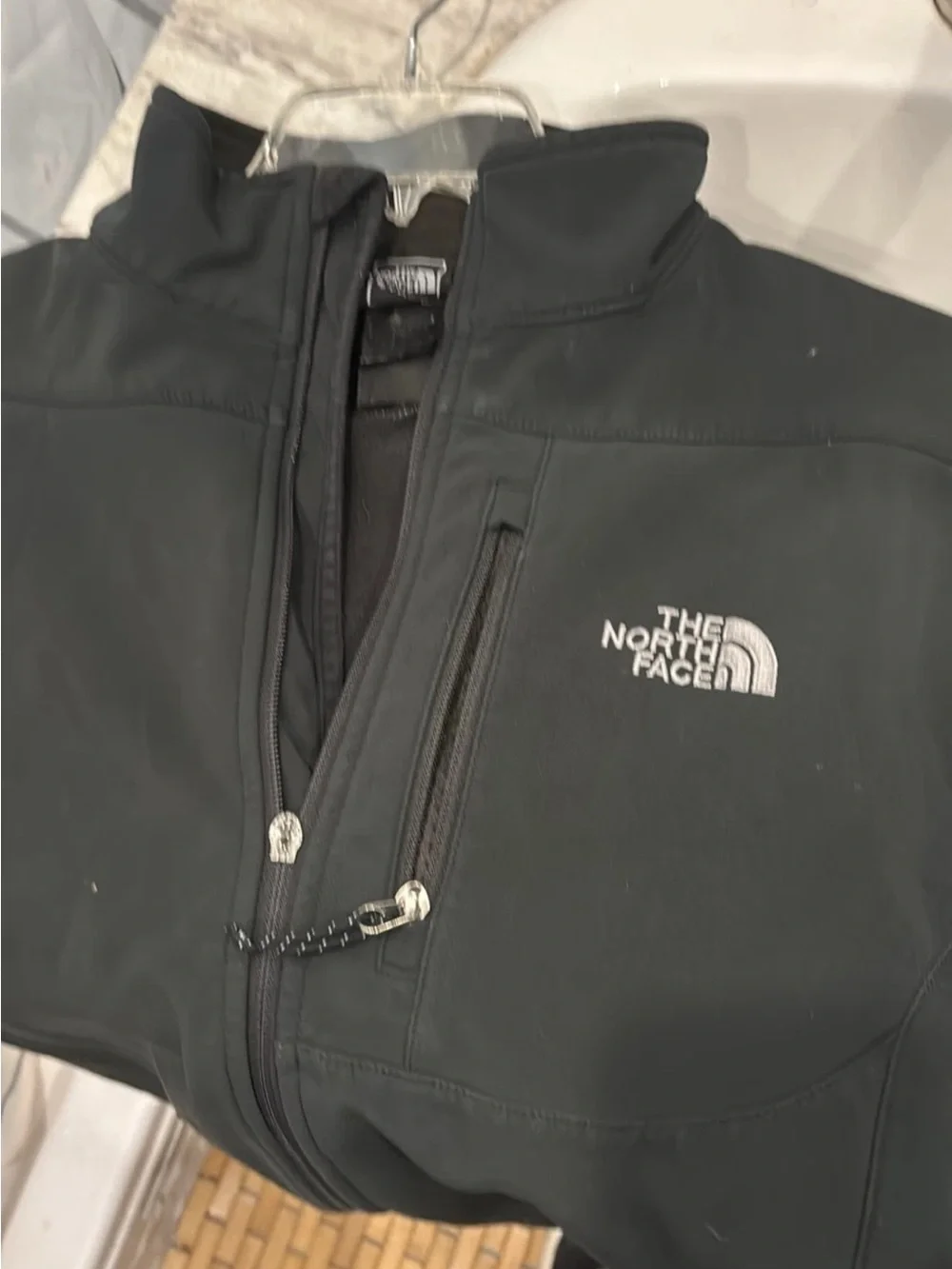 The North Face Black Softshell Jacket with Chest Zip Pocket and Embroidered Logo
